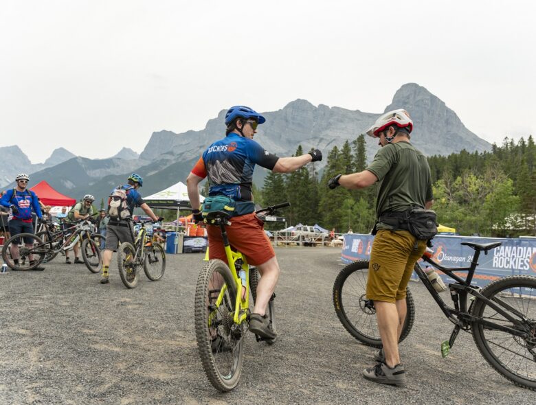 rockies 24 mountain bike racers fist bump cheer